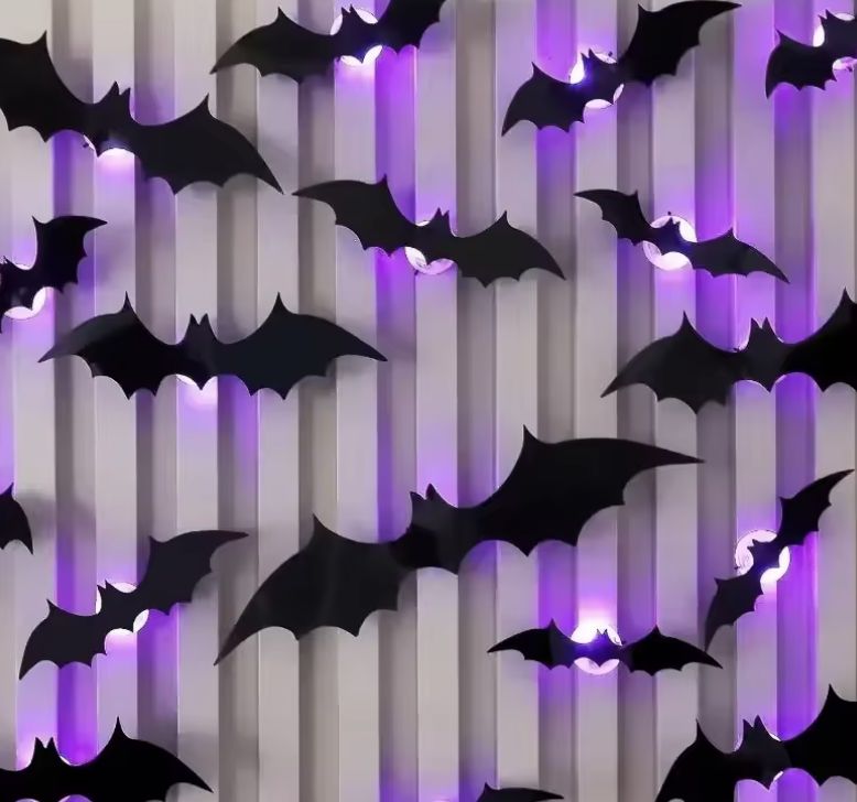 GlowBats glowing on striped wallpaper at night